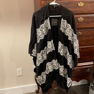 Beautiful Black Cape with shimmer and lace . With original tags . Never worn